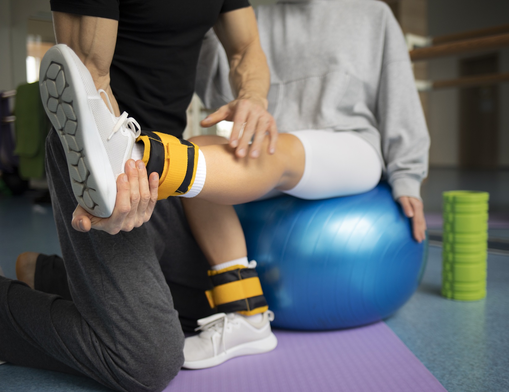 patient-doing-physical-rehabilitation-helped-by-therapists